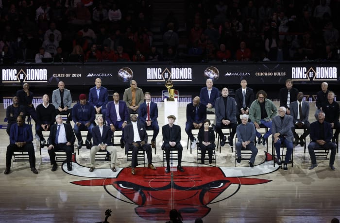 Chicago Bulls class of 2024 Ring of Honor inductees from left to right, (Back Row) Jim Cleamons, Erik Heiland, Ivika Duran, Clarence Gaines, Jr., John Ligmanowski, Chip Schaefer, Jim Stack, Al Vermeil (Middle Row) Randy Brown, Jud Buechler, Jason Coffey, James Edwards, Jack Haley, Jr., Ron Harper, Bill Wennington, Luc Longley, John Salley, Steve Kerr (Front Row) Artis Gilmore, Matt Kerr, Greg Klein, Bob Love, JJ Parrish, Thelma Krause, Chris Winter, Phil Jackson, Toni Kukoc are honored during the inaugural ceremony at halftime of a game between the Bulls and Golden State Warriors at United Center.